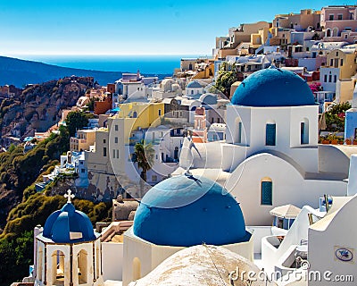 Iconic Photo of Blue Domed Churches and Buildings of Santorini Stock Photo