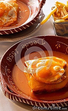 The iconic Portuguese French Sandwich also known as `Francesinha Especial`, Braga. Stock Photo