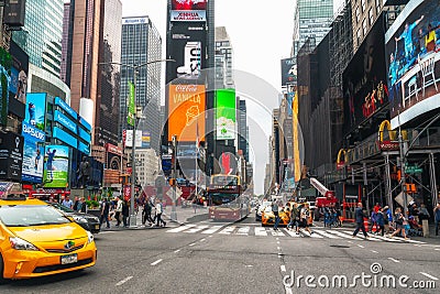 Iconic Times Square with Tourists. Brightly Illuminated Hub of the Broadway Theater District, Tourists, Traffic Editorial Stock Photo