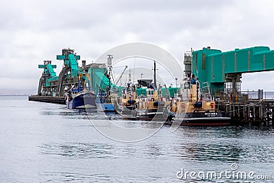 the iconic Tug boats docked against Brennans Wharf in Port Lincoln South Australia on November 19th 2021 Editorial Stock Photo