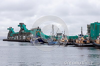 the iconic Tug boats and fishing trawlers docked against Brennans Wharf in Port Lincoln South Australia on November 19th 2021 Editorial Stock Photo