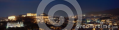 Iconic view of Acropolis hill in Athens, Greece at night. Delicate lights of Parthenon and Odeon theater. UNESCO world Editorial Stock Photo