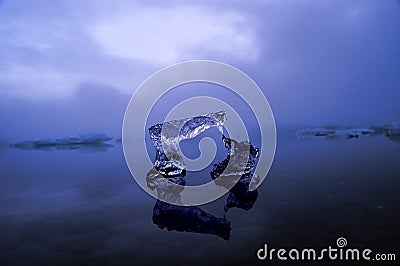 Icy arch, last vestige of an Iceberg Stock Photo