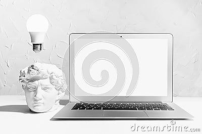 Idea and brainstorming abstract concept - image of creativity process as glow light bulb over head of white thinking statue David. Stock Photo