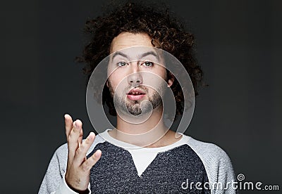 Idea, emotion, inspiration and people concept - Excited man pointing a great idea, studio shoot Stock Photo
