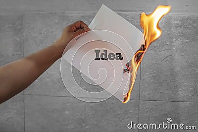 Idea on fire on paper Stock Photo