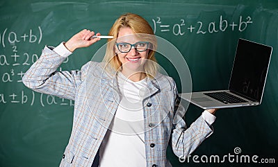 Idea on her mind. Digital technologies concept. Woman teacher wear eyeglasses holds laptop surfing internet. Educator Stock Photo