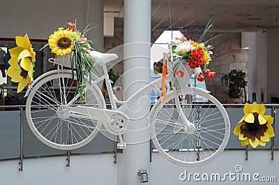 Idea for interior with white bicycle with flowers Stock Photo