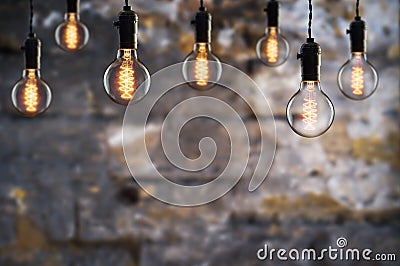 Idea and teamwork concept Vintage bulbs on wall background Stock Photo