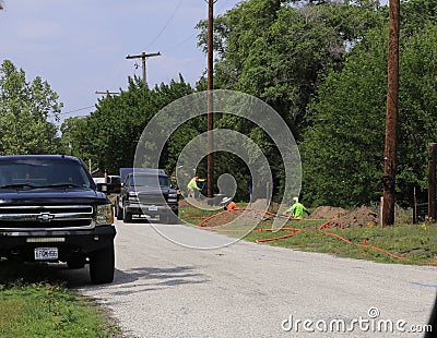 Ideatek Telcom internet workers installing fiberoptic internet Editorial Stock Photo