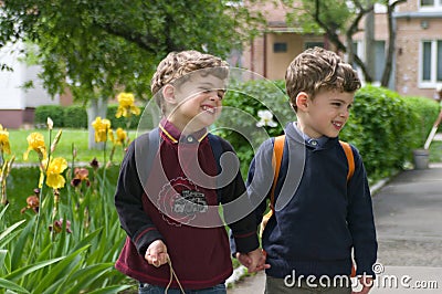 Identical twins held hands Stock Photo