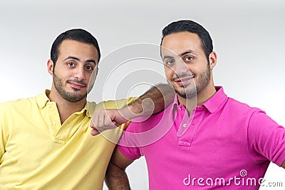 Identical twins portraits shot isolated Stock Photo
