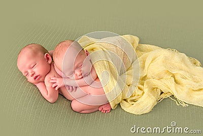 Identical twins sleeping Stock Photo