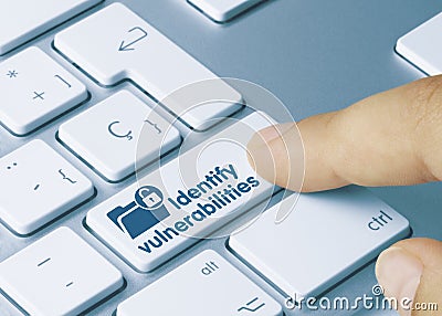 Identify vulnerabilities - Inscription on Blue Keyboard Key Stock Photo