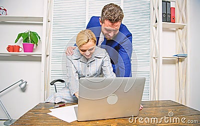 Identifying harassment. Create greater safety and trust. Sexual harassment at work. Man and woman colleagues flirt in Stock Photo