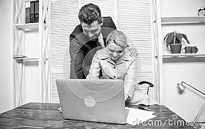 Identifying harassment. Create greater safety and trust. Sexual harassment at work. Man and woman colleagues flirt in Stock Photo