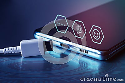 Identity icons on the smartphone's touch screen and USB Type-C cable. Securely connect your mobile device. Identity Stock Photo