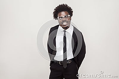 Idiotic afro man in white glasses grimacing at camera. Stock Photo