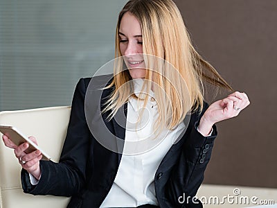 Idle inefficient worker business lady using phone Stock Photo