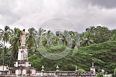 Idol of Lord Jesus with a forest in the background Stock Photo