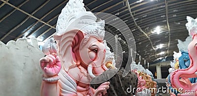 A idol maker is giving the final touch for Vinayaka or Ganesha idol in the occasion of Vinayaka or Ganesha Chaturthi. Editorial Stock Photo