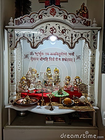 Small decorated temple in the home of Hindu family Editorial Stock Photo