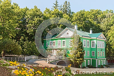 Idyllic green home in the garden in sunny summer day Stock Photo