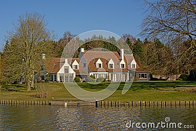 Idyllic house along river Lys in Flanders, Belgium Editorial Stock Photo