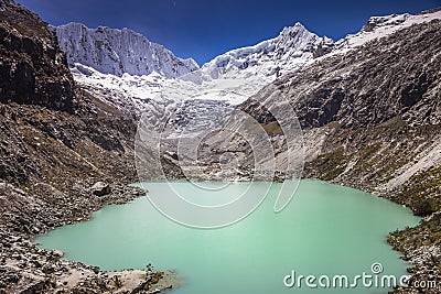 Llaca lake in Cordillera Blanca with snowcapped Andes, Ancash, Peru Stock Photo