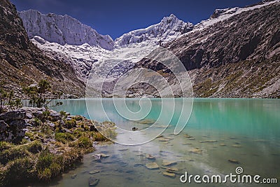 Llaca lake in Cordillera Blanca with snowcapped Andes, Ancash, Peru Stock Photo