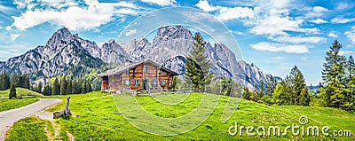 Idyllic landscape in the Alps with mountain chalet Stock Photo