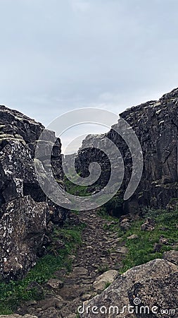 Idyllic landscape of a rocky terrain with a variety of vegetation and grassy areas in between Stock Photo