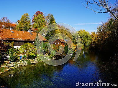 Idyllic living on the riverside between autumn trees Stock Photo