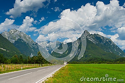 Idyllic mountain valley with road Stock Photo
