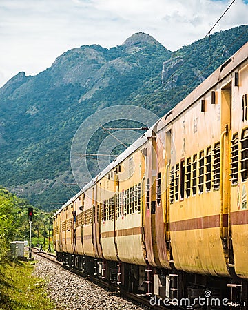 Idyllic scene of a train traveling through a picturesque countryside landscape Editorial Stock Photo