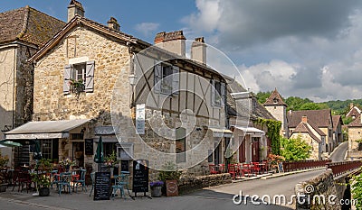Idyllic street cafÃ© and restaurant in the historic village of Carennac in the Dordogne Valley Editorial Stock Photo
