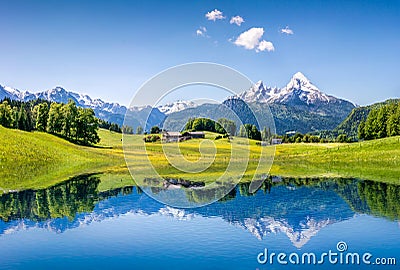 Idyllic summer landscape with clear mountain lake in the Alps Stock Photo