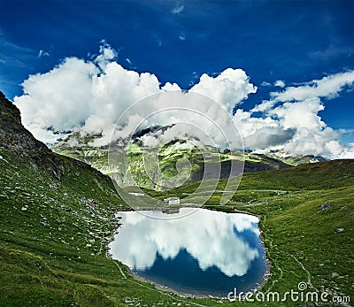 Idyllic summer landscape with clear mountain lake in the Alps Stock Photo