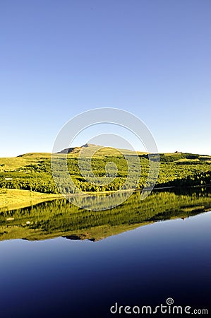 Idyllic summer landscape with clear mountain lake Stock Photo