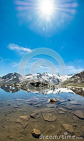 Idyllic summer panorama with clear mountain lake Stock Photo