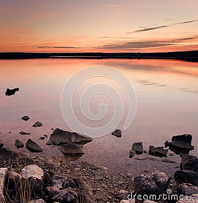 Idyllic sunset over sea water Stock Photo