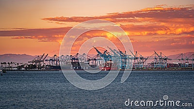 Idyllic sunset view of a harbor with multiple ships on the distant horizon in Long Beach, USA. Editorial Stock Photo