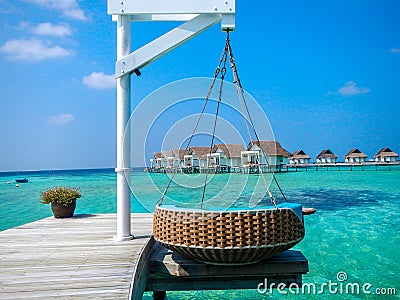 Idyllic tropical resort with stilt huts and jetty Stock Photo