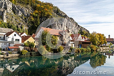 Idyllic view at the village Markt Essing in Bavaria, Germany with the Altmuehl river and high rocks i Stock Photo