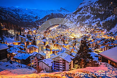 Idyllic village of Zermatt rooftops evening view, luxury winter destination Stock Photo