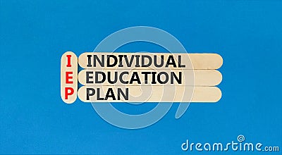 IEP individual education plan symbol. Concept words IEP individual education plan on wooden sticks on beautiful blue table blue Stock Photo