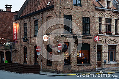 Ieper, West Flanders Region - Belgium - Traditional cafe facade in the historical city center at dusk Editorial Stock Photo
