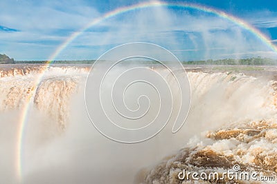 Iguazu waterfalls with a rainbow. Photo at Argentinian side, Devil throat. Stock Photo