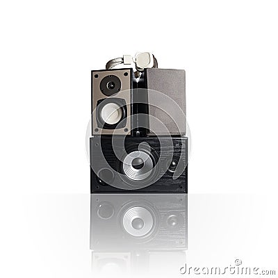 Iimage of three audio speakers and headphones, isolated on white. Stock Photo