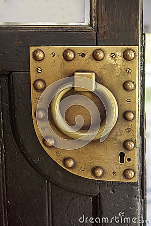 Iron antique door with brass ring handle Editorial Stock Photo